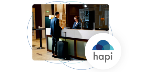 a picture of a business man checking into a hotel with a "Hapi" logo in the bottom right corner