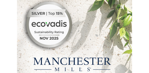 Manchester Mills logo over a sandy background