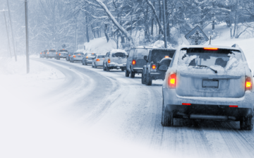 A line of cars on a snowy road